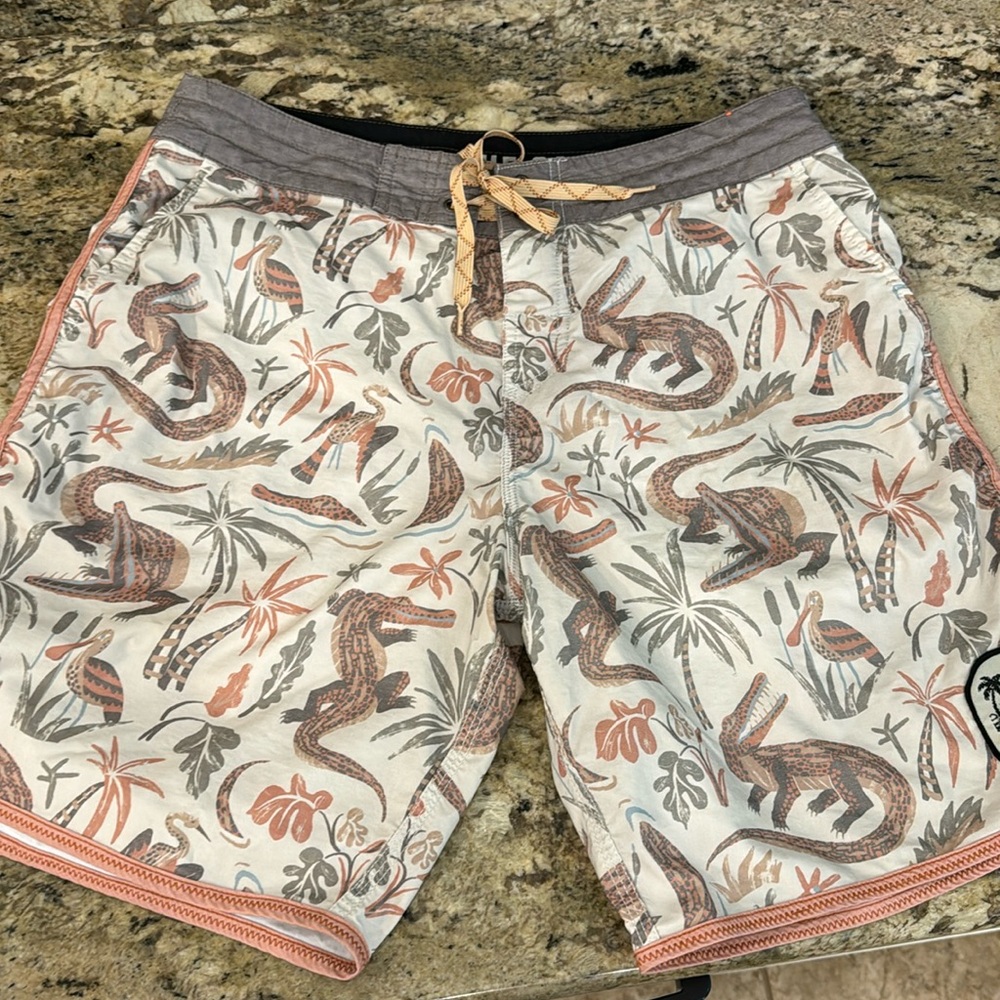 Men’s HEED THE CALL board shorts.